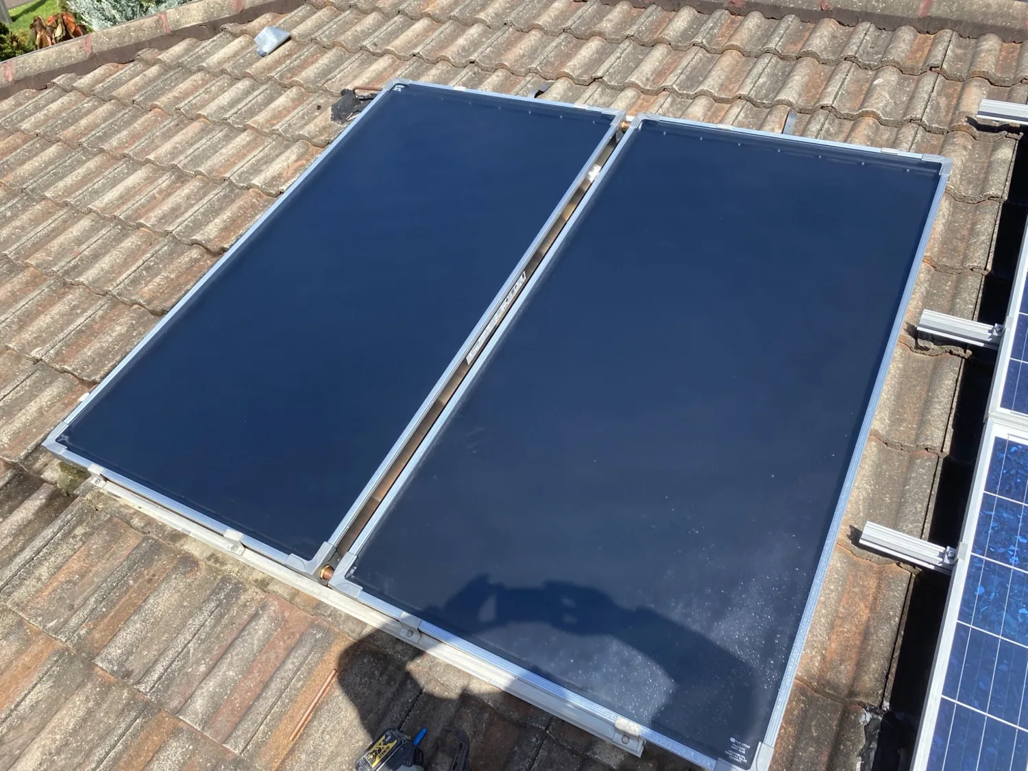 Roof-mounted solar hot water collector panels