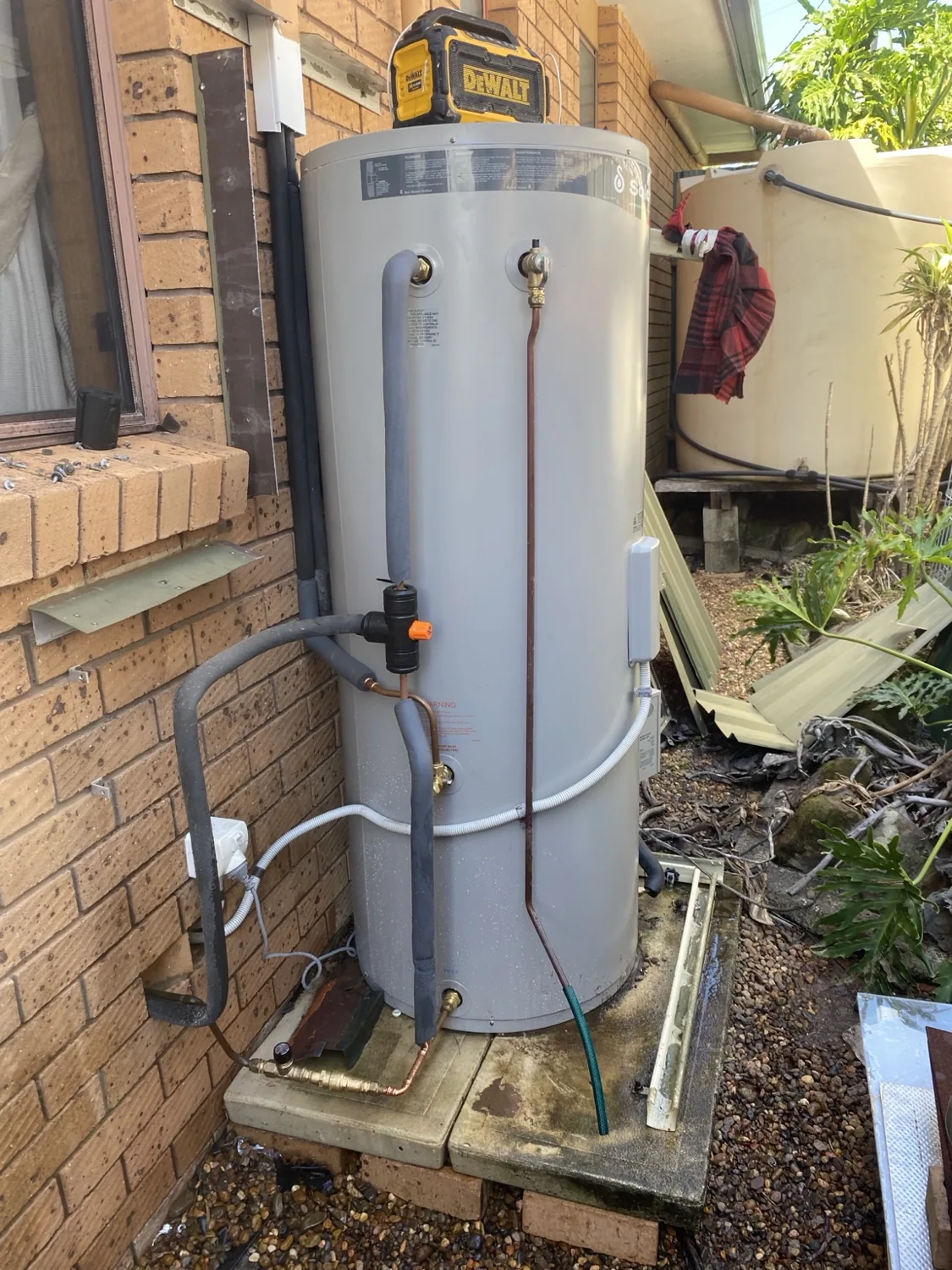Solar hot water storage tank and connected pipework